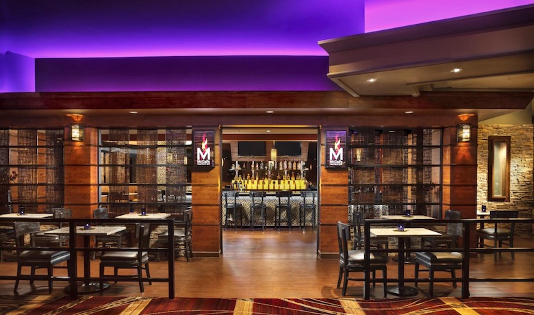 A screenshot of the dining area and bar at McCall's Heartland Grill restaurant in The Stratosphere Hotel and Casino Las Vegas.