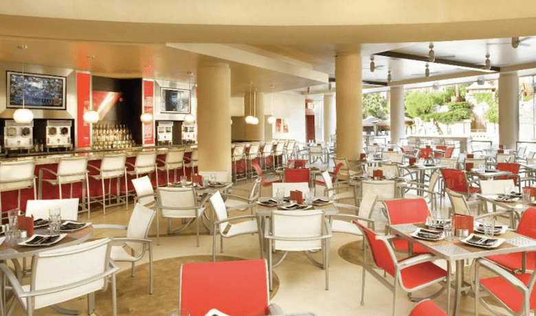 A screenshot of the dining area and Beach Bar & Grill at the Mandalay Bay Hotel and Casino Las Vegas pool area.