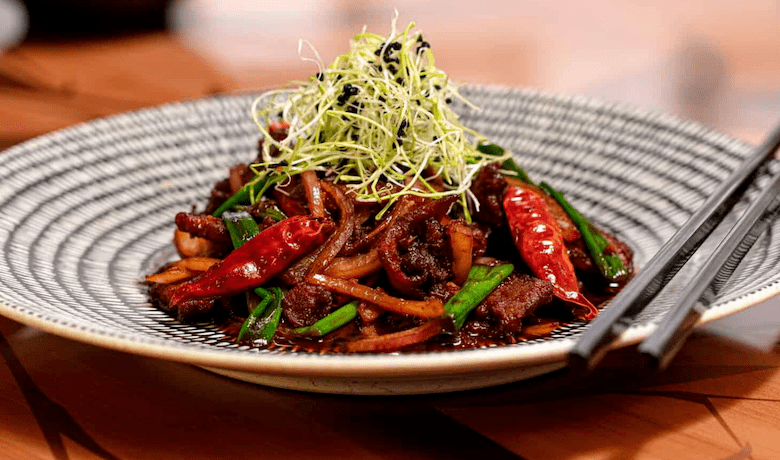 A screenshot of a spicy beef dish from Noodle Shop Restaurant in the Mandalay Bay Hotel and Casino Las Vegas.