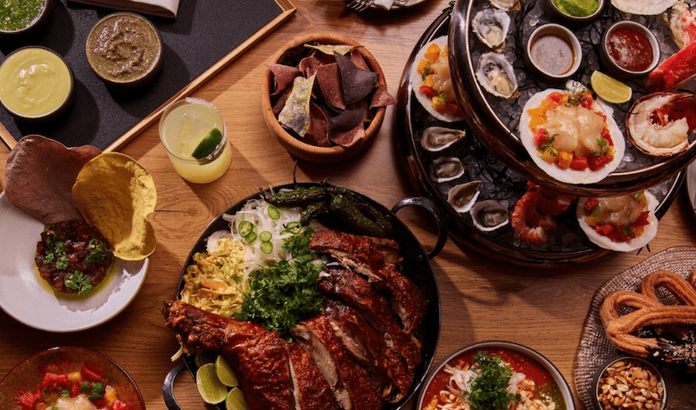 A screenshot of a table with various dishes from Casa Playa Mexican Restaurant in the Encore Hotel and Casino Las Vegas.